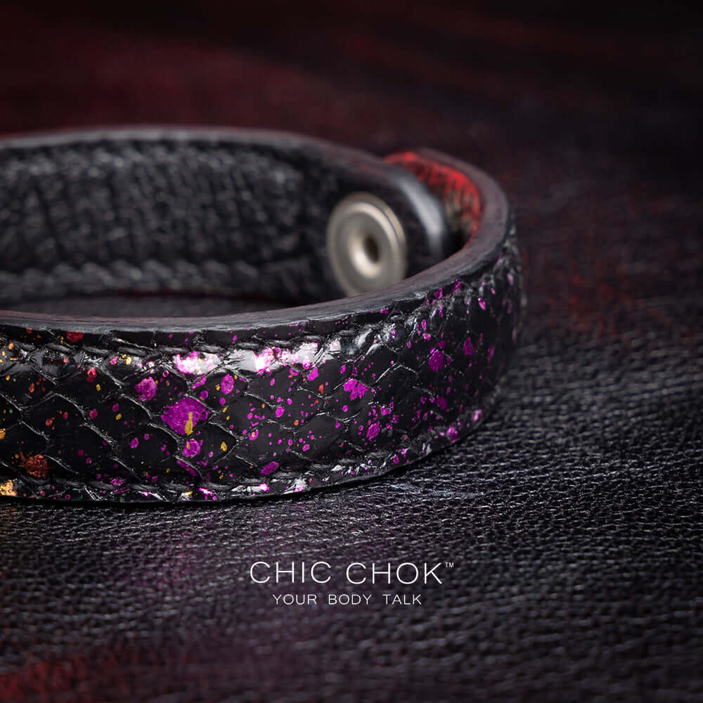 Nebula Doll Bracelet Luxurious black leather bracelet with textured scales, adorned with shimmering multicolor glitter accents, inspired by the brilliance of a starry night sky, showcasing elegance and individuality.