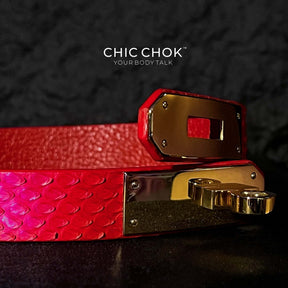 A vibrant red textured leather bracelet featuring a gold-tone stainless steel lock closure, designed by CHICCHOK for bold and luxurious style. Ideal for versatile fashion statements and perfect as a gift.