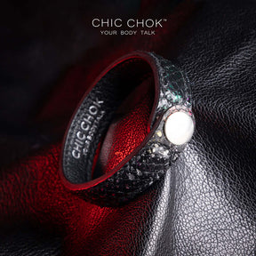 Nebula Doll Bracelet Luxurious black leather bracelet with textured scales, adorned with shimmering multicolor glitter accents, inspired by the brilliance of a starry night sky, showcasing elegance and individuality.